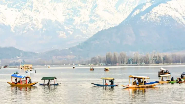 Dal Lake with boats and mountains in the background